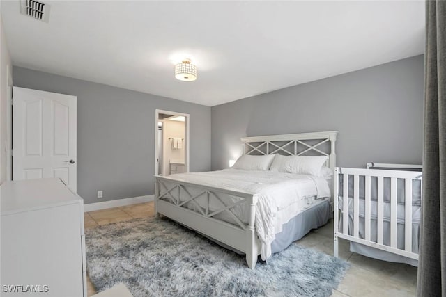3410 Frosty Way Unit 4802, Naples, FL 34112 - bedroom with light tile patterned flooring and baseboards