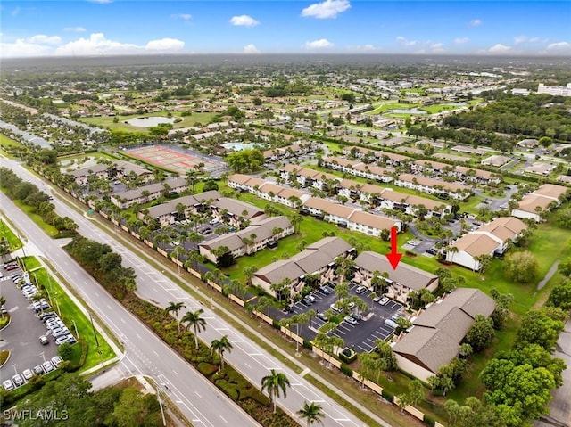 3410 Frosty Way Unit 4802, Naples, FL 34112 - aerial view of property and surrounding area with a large body of water and nearby suburban area