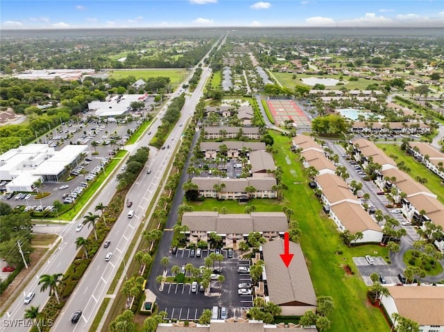 3410 Frosty Way Unit 4802, Naples, FL 34112 - aerial view of property and surrounding area with a major roadway, nearby suburban area, and a nearby body of water