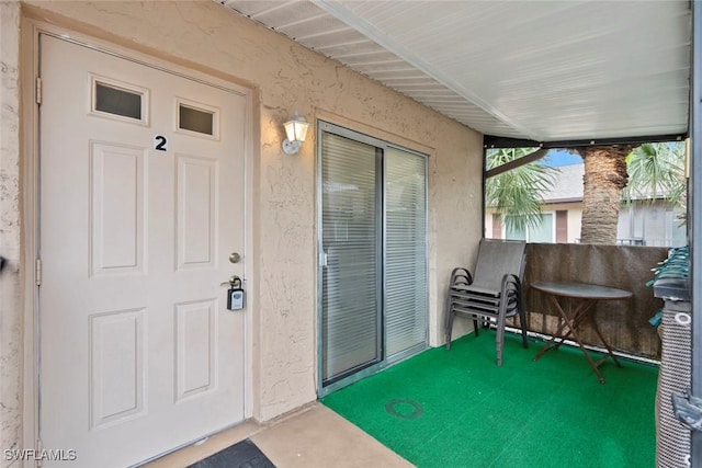 3410 Frosty Way Unit 4802, Naples, FL 34112 - view of exterior entry featuring stucco siding