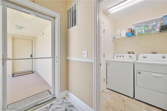 15041 Bridgeway Ln Unit 1006, Fort Myers, FL 33919 - washroom featuring separate washer and dryer and baseboards