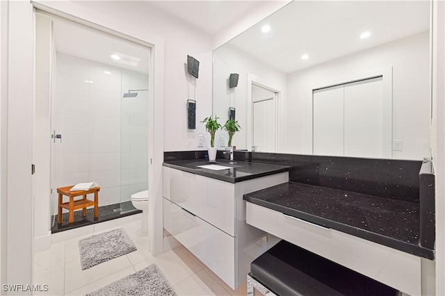 15041 Bridgeway Ln Unit 1006, Fort Myers, FL 33919 - full bath with vanity, toilet, a stall shower, tile patterned flooring, and recessed lighting