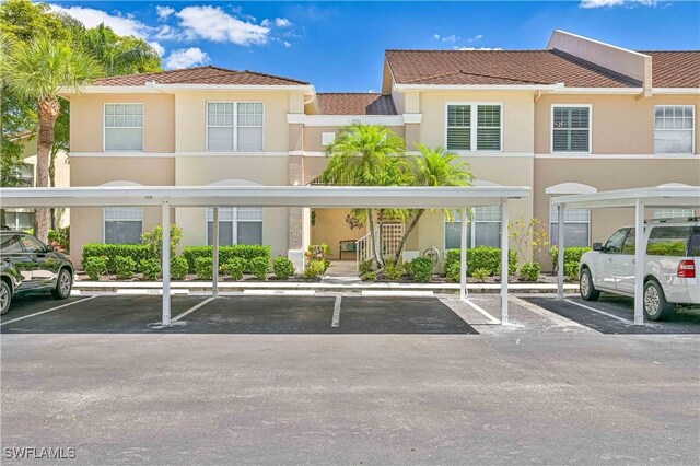 15041 Bridgeway Ln Unit 1006, Fort Myers, FL 33919 - covered parking lot with stairs
