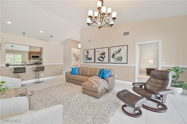 15041 Bridgeway Ln Unit 1006, Fort Myers, FL 33919 - living area featuring a chandelier, light tile patterned flooring, high vaulted ceiling, recessed lighting, and baseboards
