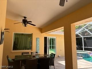 672 Seagrape Dr, Marco Island, FL 34145 - view of patio featuring a ceiling fan, an outdoor hot tub, glass enclosure, and an outdoor pool
