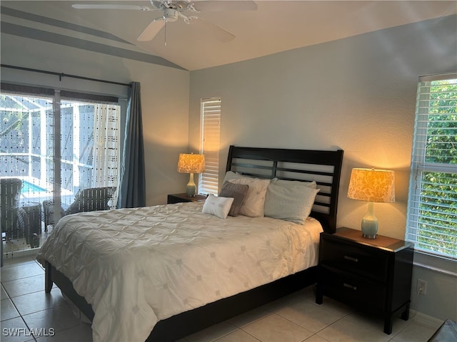 672 Seagrape Dr, Marco Island, FL 34145 - tiled bedroom featuring vaulted ceiling, multiple windows, and a ceiling fan