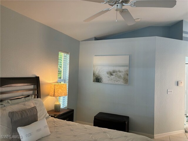 672 Seagrape Dr, Marco Island, FL 34145 - bedroom featuring lofted ceiling and ceiling fan
