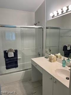 672 Seagrape Dr, Marco Island, FL 34145 - full bath featuring shower / bath combination with glass door and vanity