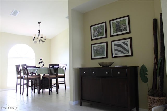 672 Seagrape Dr, Marco Island, FL 34145 - dining space featuring a chandelier, baseboards, and light tile patterned floors