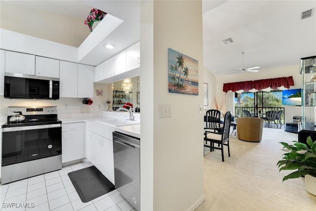 7340 Coventry Ct Unit 827, Naples, FL 34104 - kitchen featuring appliances with stainless steel finishes, light countertops, white cabinets, a ceiling fan, and recessed lighting