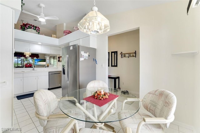7340 Coventry Ct Unit 827, Naples, FL 34104 - dining area featuring light tile patterned flooring, ceiling fan, and a chandelier