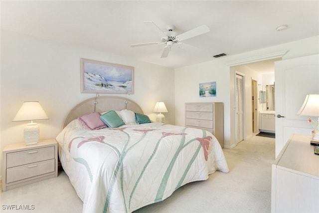 7340 Coventry Ct Unit 827, Naples, FL 34104 - bedroom with light carpet, a closet, ensuite bathroom, and ceiling fan