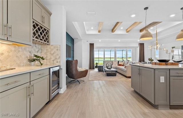 7393 Blue Salvia Dr, North Fort Myers, FL 33917 - kitchen featuring gray cabinets, wine cooler, tasteful backsplash, light countertops, and recessed lighting