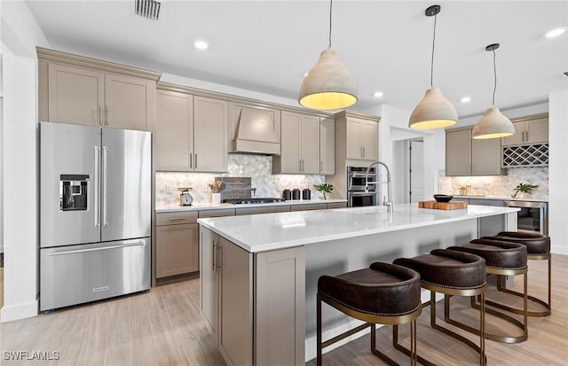 7393 Blue Salvia Dr, North Fort Myers, FL 33917 - kitchen featuring appliances with stainless steel finishes, gray cabinetry, wine cooler, custom range hood, and light countertops