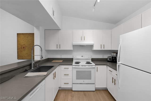 8224 Key Royal Cir Unit 232, Naples, FL 34119 - kitchen with white appliances, under cabinet range hood, vaulted ceiling, a sink, and dark countertops