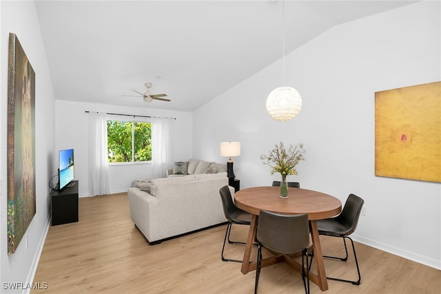 8224 Key Royal Cir Unit 232, Naples, FL 34119 - dining area featuring vaulted ceiling, light wood-style floors, a ceiling fan, and baseboards