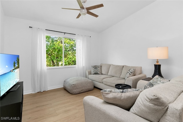 8224 Key Royal Cir Unit 232, Naples, FL 34119 - living room with lofted ceiling, ceiling fan, light wood-style flooring, and baseboards