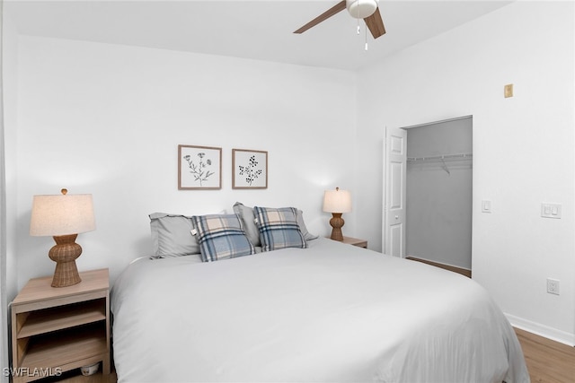 8224 Key Royal Cir Unit 232, Naples, FL 34119 - bedroom with wood finished floors, baseboards, a closet, and a ceiling fan