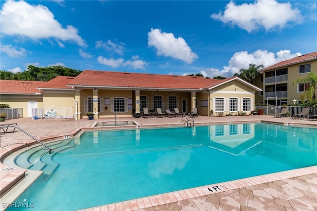 8224 Key Royal Cir Unit 232, Naples, FL 34119 - community pool featuring a patio area