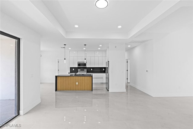 kitchen featuring appliances with stainless steel finishes, open floor plan, modern cabinets, white cabinets, and recessed lighting