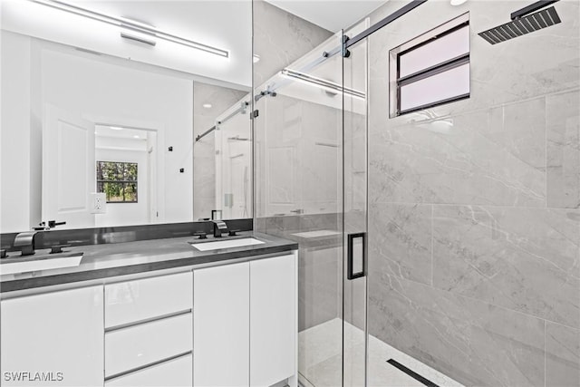 full bath with a shower stall and vanity
