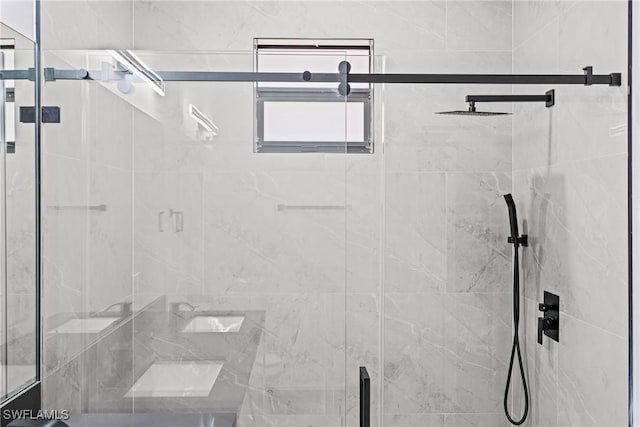 full bath with a shower stall