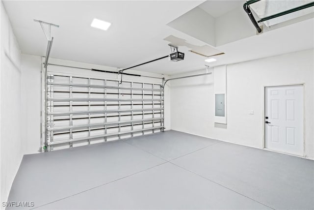 garage featuring a garage door opener and electric panel