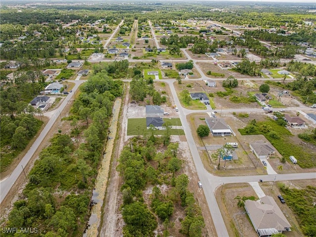 aerial view of property's location with nearby suburban area