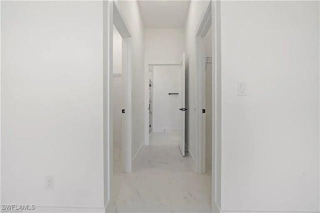 467 Paddock St, Lehigh Acres, FL 33974 - hall with marble look tile flooring and baseboards