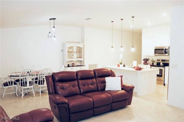 332 Pembroke St, Lehigh Acres, FL 33974 - living room featuring light tile patterned floors and recessed lighting