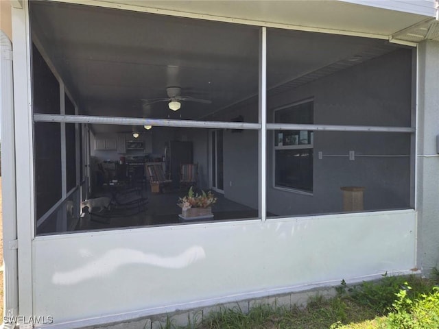 332 Pembroke St, Lehigh Acres, FL 33974 - rear view of house featuring a sunroom and ceiling fan