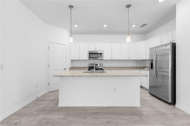 11226 Shady Blossom Dr, Fort Myers, FL 33913 - kitchen featuring stainless steel appliances, white cabinetry, light wood-style flooring, recessed lighting, and a kitchen island with sink