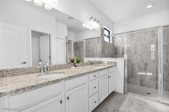 11226 Shady Blossom Dr, Fort Myers, FL 33913 - full bathroom with double vanity and a shower stall