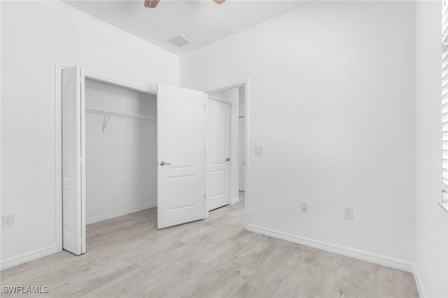 11226 Shady Blossom Dr, Fort Myers, FL 33913 - unfurnished bedroom featuring light wood-type flooring, baseboards, a closet, and ceiling fan