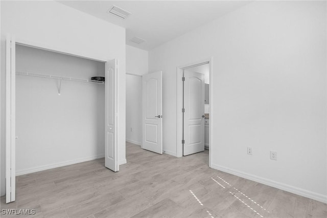 11226 Shady Blossom Dr, Fort Myers, FL 33913 - unfurnished bedroom with a closet, baseboards, and ensuite bathroom