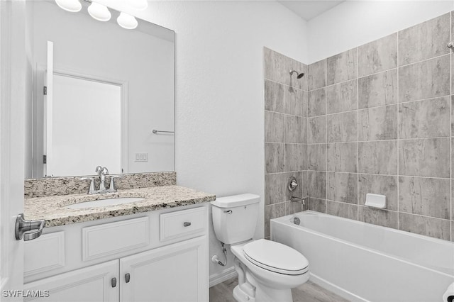 11226 Shady Blossom Dr, Fort Myers, FL 33913 - bathroom with vanity, toilet, bathtub / shower combination, and wood finished floors