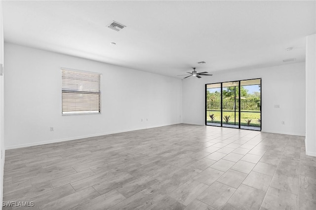 11226 Shady Blossom Dr, Fort Myers, FL 33913 - spare room featuring ceiling fan and baseboards