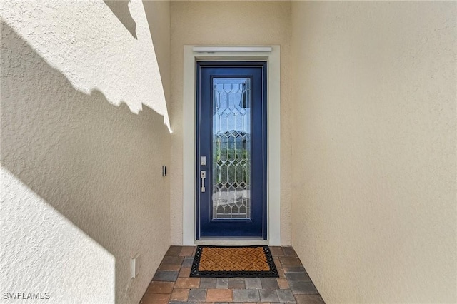 11226 Shady Blossom Dr, Fort Myers, FL 33913 - view of exterior entry featuring stucco siding