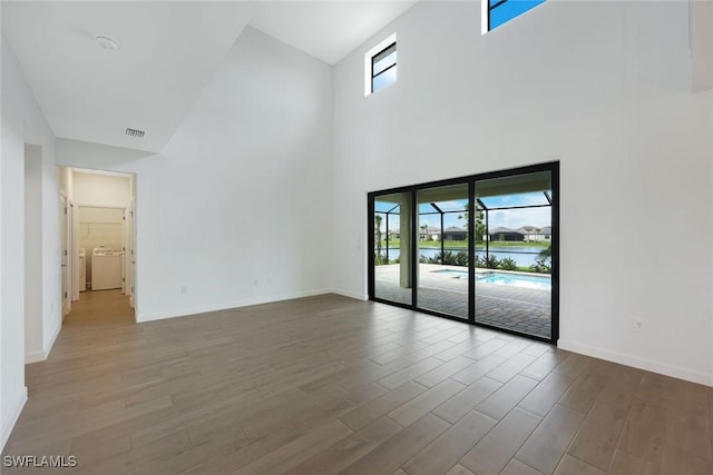 20669 Greenwich Pl, Estero, FL 33928 - unfurnished room featuring a high ceiling and wood finished floors