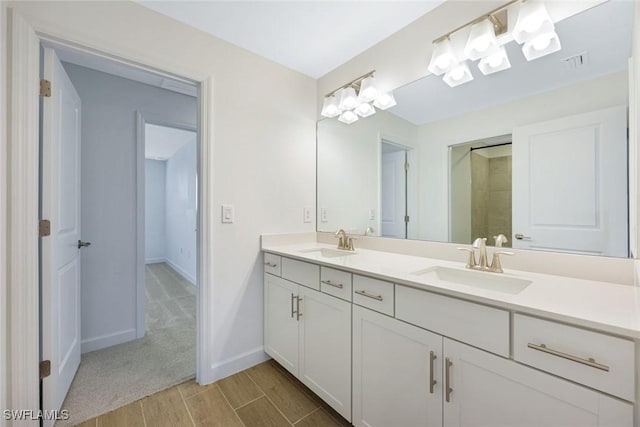 20669 Greenwich Pl, Estero, FL 33928 - full bathroom featuring double vanity and wood finished floors