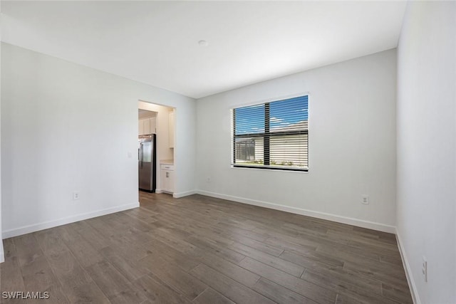 20669 Greenwich Pl, Estero, FL 33928 - empty room with wood finished floors and baseboards