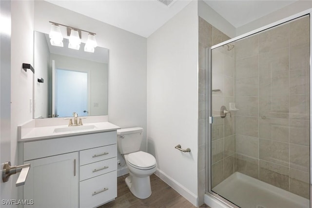 20669 Greenwich Pl, Estero, FL 33928 - bathroom featuring a stall shower, wood finished floors, and vanity
