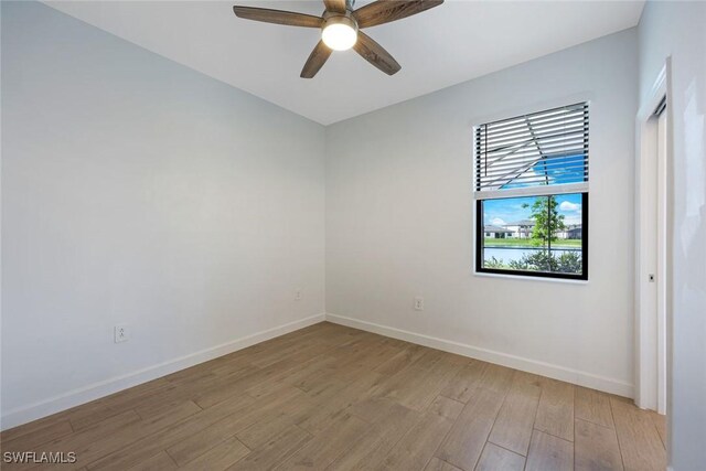 20669 Greenwich Pl, Estero, FL 33928 - unfurnished room featuring light wood-style floors and a ceiling fan