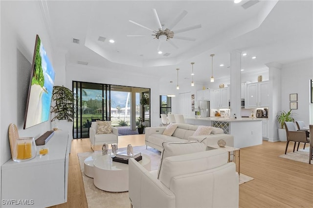 3813 Columbia Ct, Naples, FL 34119 - living area with a raised ceiling, a ceiling fan, light wood finished floors, and recessed lighting
