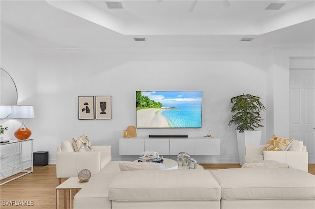 3813 Columbia Ct, Naples, FL 34119 - living area featuring wood finished floors and a tray ceiling