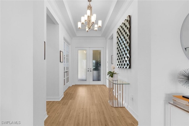 3813 Columbia Ct, Naples, FL 34119 - foyer with french doors, light wood-type flooring, a chandelier, baseboards, and crown molding