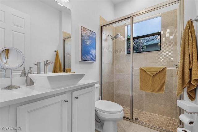 3813 Columbia Ct, Naples, FL 34119 - full bathroom with toilet, a stall shower, and double vanity