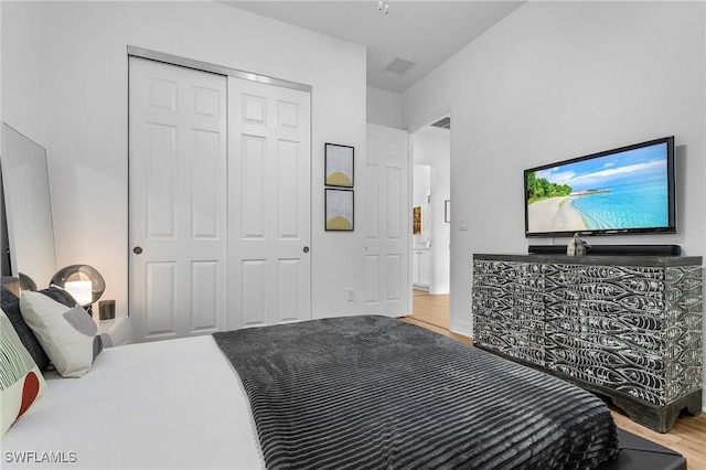 3813 Columbia Ct, Naples, FL 34119 - bedroom featuring wood finished floors and a closet