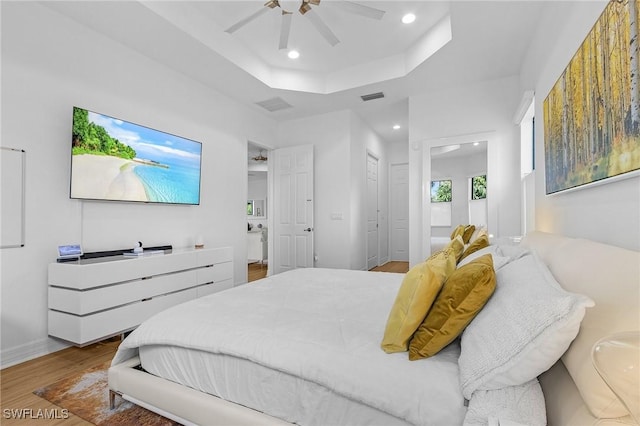 3813 Columbia Ct, Naples, FL 34119 - bedroom with recessed lighting, wood finished floors, a raised ceiling, ceiling fan, and ensuite bathroom