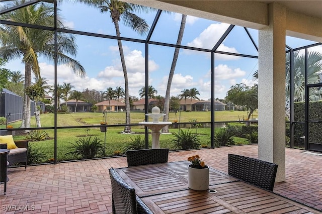 3813 Columbia Ct, Naples, FL 34119 - sunroom featuring outdoor dining area and a residential view
